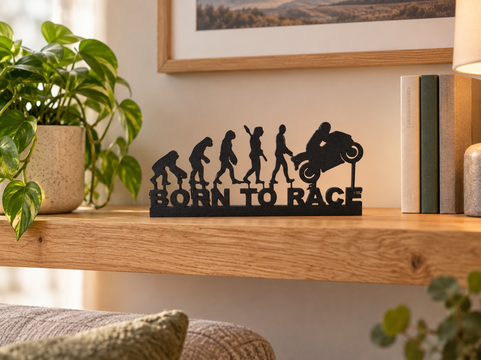 Black Born to Race 3D printed motorcycle evolution display on a living room shelf
