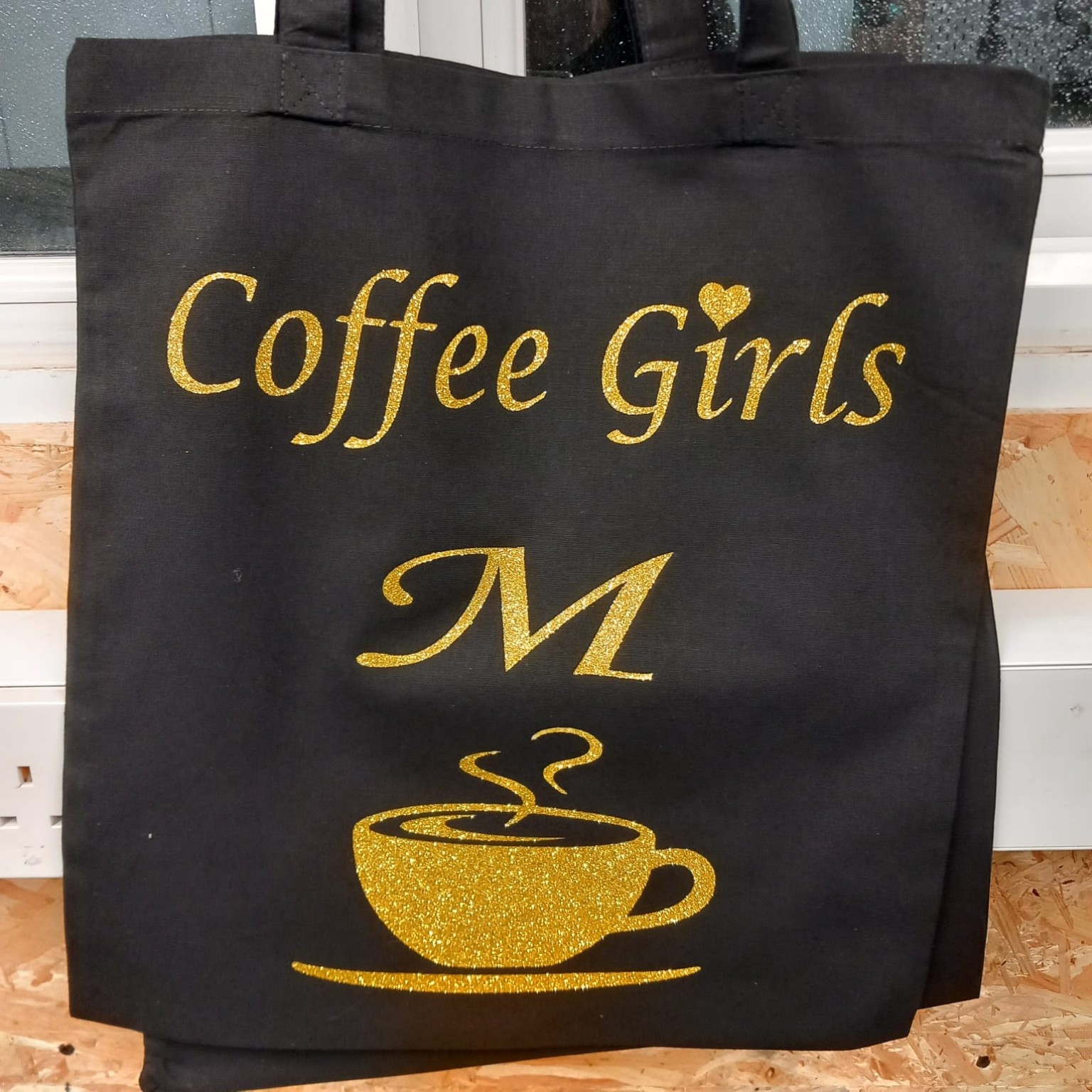 Black Coffee Girls tote bag personalised with a gold initial M and coffee cup design