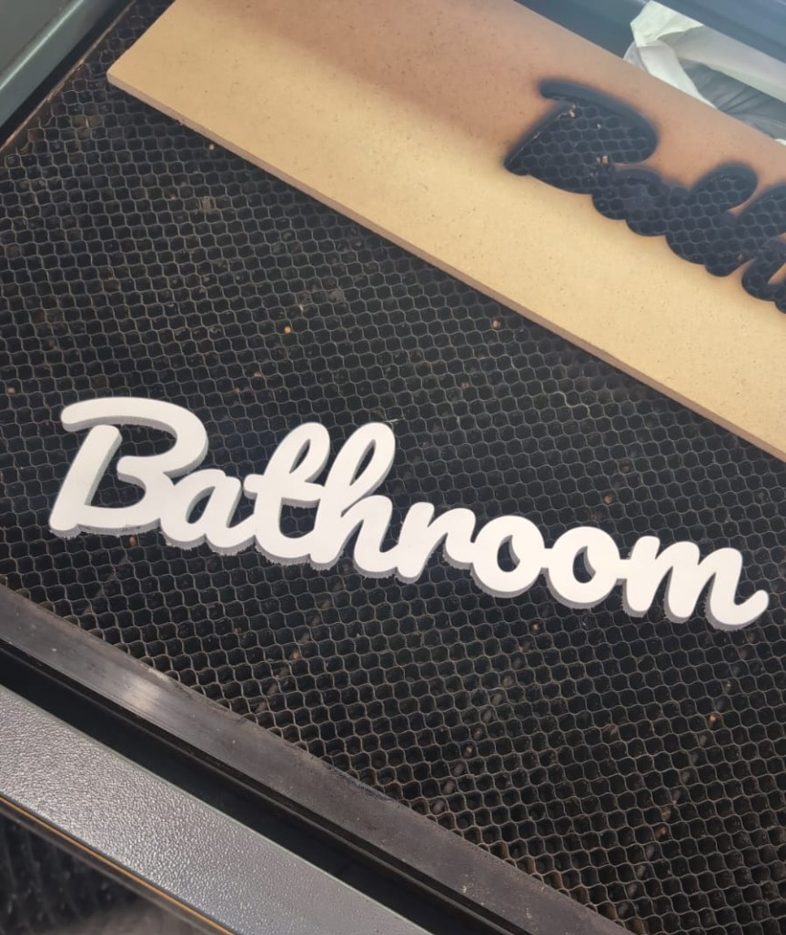 Laser-cut Bathroom sign