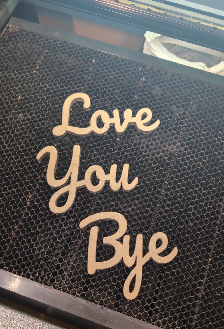 Wooden Love You Bye laser-cut lettering